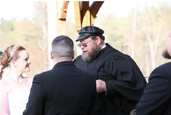 jewish wedding officiant richard winer with couple at altar