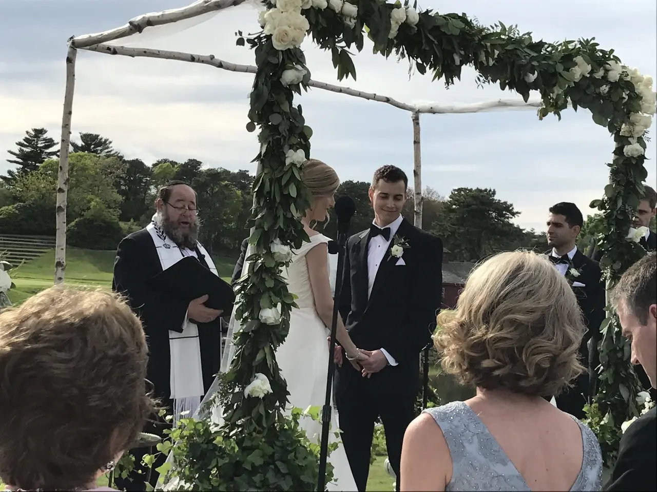 chuppah with white floral garland