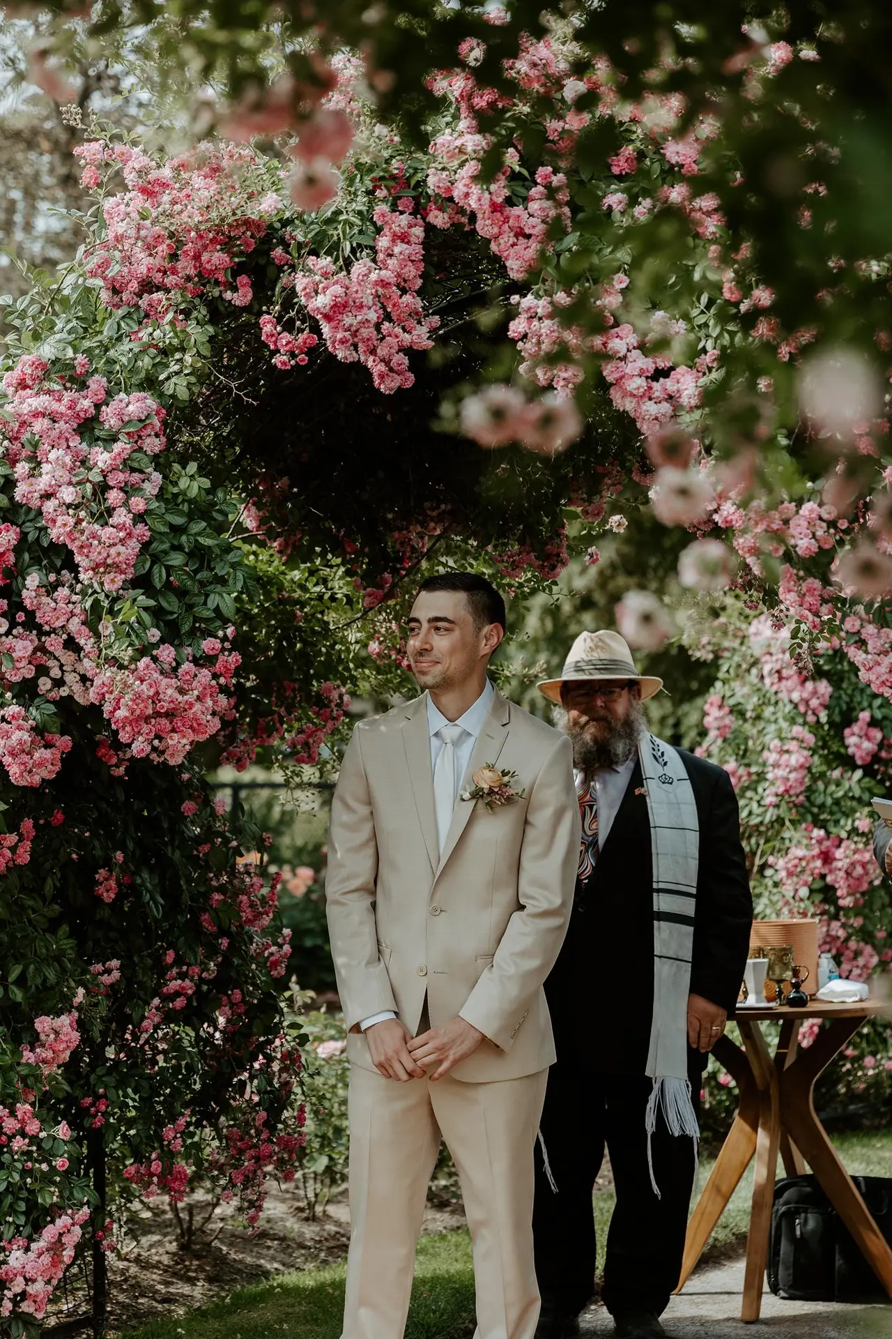 groom watching bride walk down aisle