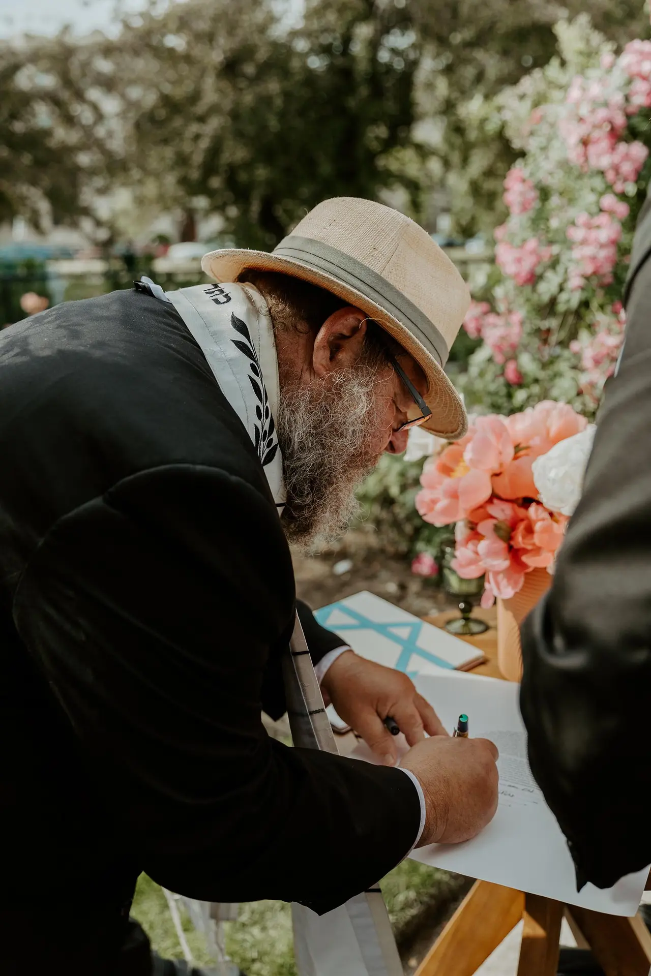 Rabbi Richard Winer signing a marriage license