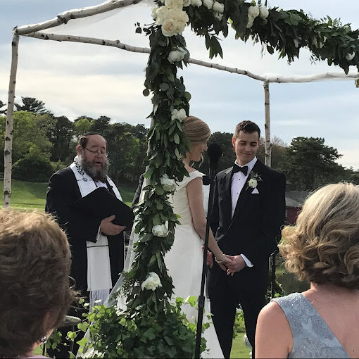 Couples getting married by Rabbi Winer